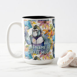 Gorilla hält den Big Book Coffee zwei Tasse