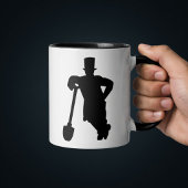 Grab mit Schaufel  Tasse