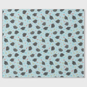 Graduierungskappe und Tassel auf hellblau Geschenkpapier (Flach)