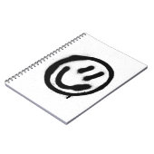 Graffiti lächelnd Gesicht Emoticon in schwarz auf  Notizblock (Linke Seite)