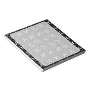 Grafikmuster für den weißen Schädel und die Kre Notizblock