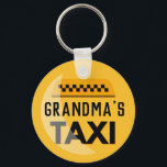 Grandma's Taxi Keychain Schlüsselanhänger<br><div class="desc">Grandma busy driving the grandkids around enough to warrant recognition as a taxi service? This is the perfect,  funny gift for her. Yellow and black taxi-style emblem with words,  "Grandma's Taxi" in black" features digitally rendered highlight and checkered pattern icon above title.</div>