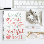 Grateful Heart | Hand Lettered Typography Quote Notizblock<br><div class="desc">Spread an attitude of gratitude. Our handwritten typography notebook design features the quote "begin each day with a grateful heart" in pastel hued hand lettered calligraphy script adorned with swashes and a heart illustration.</div>