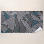 Graue Dreiecksausschnitte mit groben dunkelblauen  Strandtuch (Vorderseite)