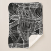 Graue, gekrümmte Bänder, kontrastiert mit geprägte Sherpadecke (Vorderseite)