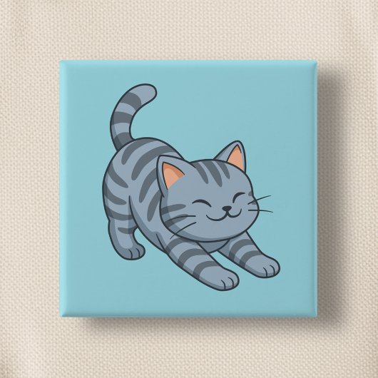 Graue getigerte Katze in Blau beim Strecken Button