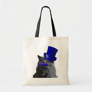 Graue Katze mit blauem Zylinder und dem blauen Tragetasche