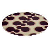 Graue, kugelförmige Formen, braune Farbmuster. Schneidebrett (Ecke)