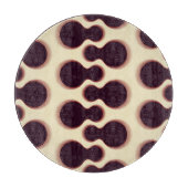 Graue, kugelförmige Formen, braune Farbmuster. Schneidebrett (Vorderseite)