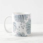 Graue Monstera-Blätter auf weiß Kaffeetasse (Links)