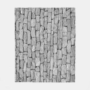 Graue Steinmauer, abstrakter Hintergrund. Fleecedecke