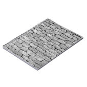 Graue Steinmauer, abstrakter Hintergrund. Notizblock (Linke Seite)