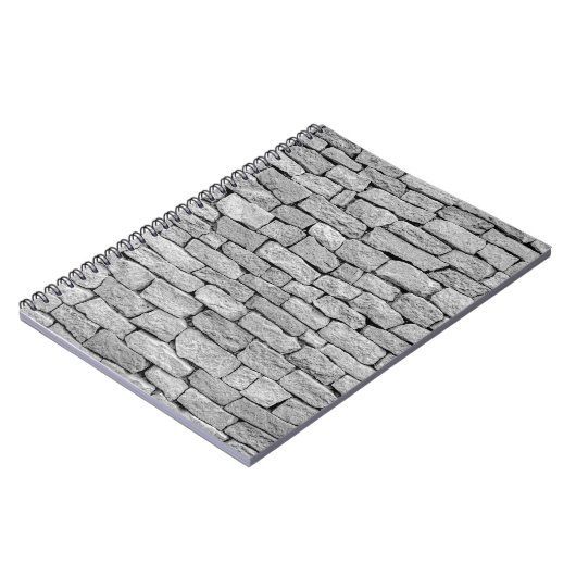 Graue Steinmauer, abstrakter Hintergrund. Notizblock (Linke Seite)