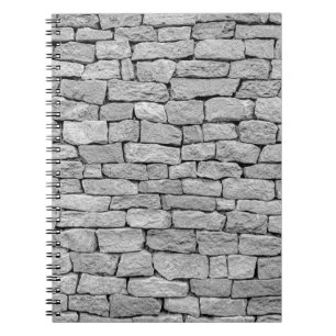 Graue Steinmauer, abstrakter Hintergrund. Notizblock