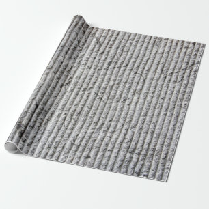 Graue Steinwandstruktur. Textur einer Steinwand mi Geschenkpapier