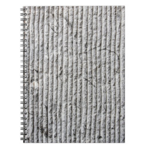 Graue Steinwandstruktur. Textur einer Steinwand mi Notizblock