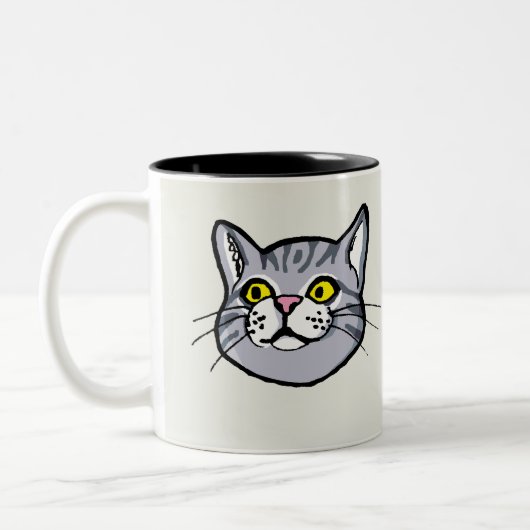 Graue Tabby-Katze, die Tasse zeichnet (Links)