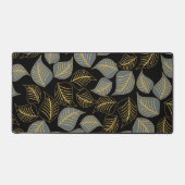 Graue und goldfarbene Blätter auf schwarz Schreibtischunterlage (Vorderseite)