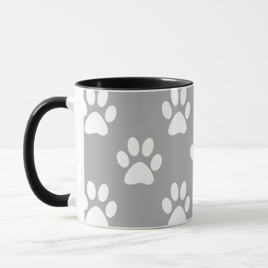 Graue und weiße Pfotenmuster Tasse (Links)