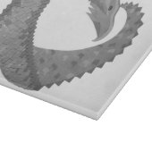 Grauer Herzdrache auf Weiß Schneidebrett (Ecke)