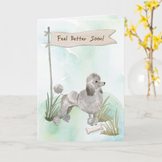 Graues Poodle fühlt sich nach der Operation mit de Karte (Gelbe Blume)