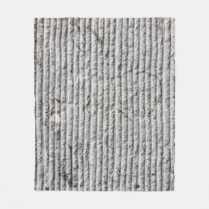 Grausteinfarbene Wandstruktur. Textur der Steinmau Fleecedecke