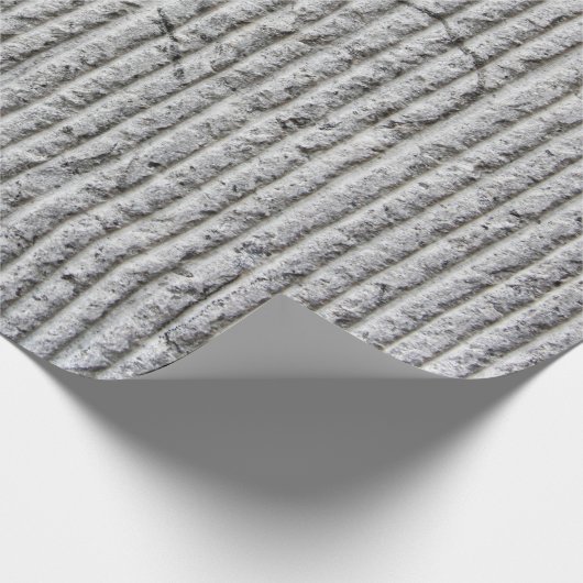 Grausteinfarbene Wandstruktur. Textur der Steinmau Geschenkpapier (Ecke)