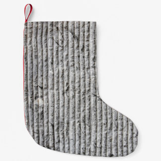 Grausteinfarbene Wandstruktur. Textur der Steinmau Kleiner Weihnachtsstrumpf