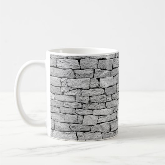 Grausteinmauer als abstrakter Hintergrund. Kaffeetasse (Links)