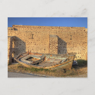 Greece, Santorini, Oia. Old fishing boat on dry Postkarte