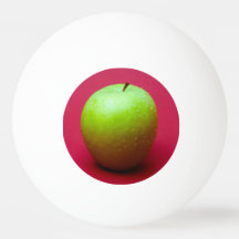 Green apple on red background
