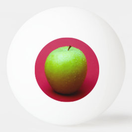 Green apple on red background tischtennisball