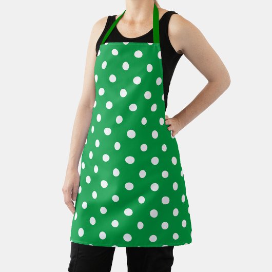 Green apron with white polka dots, displayed flat schürze