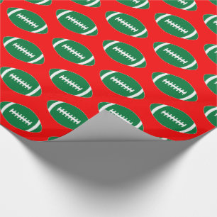 Green Footballs auf Red Background Weihnachtsgesch Geschenkpapier