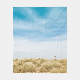 Green grass field under blue skies fleecedecke