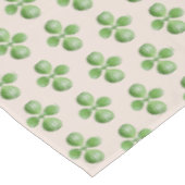 Green Jade Tree Blätter auf hellbeige Tischdecke (Schrägansicht)