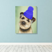 Grenzer Terrier mit blauem Bobble Hat Leinwanddruck (Insitu (Holzboden))