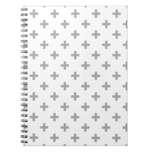 Grey polka crosses on white notizblock