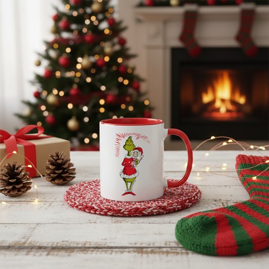 Grinch hält Cindy Lou Who Tasse
