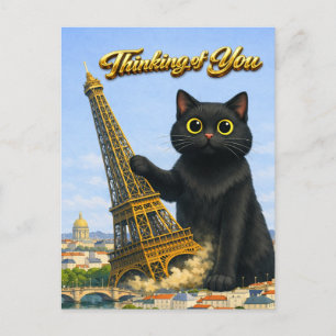 Große schwarze Katze wirft Eiffelturm um, während Postkarte