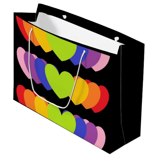 Große schwarze Tasche mit Regenbogenfarben - Herz Große Geschenktüte (Vorderseite Schrägansicht)