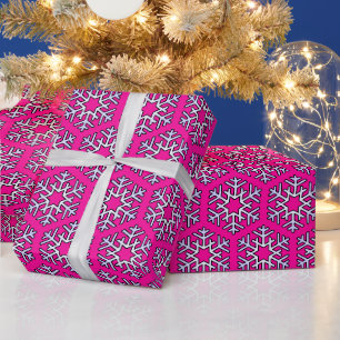 Große Silberschneeflocken auf heiß rosa Geschenkpapier