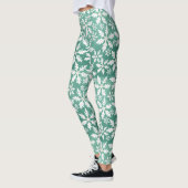 Große weiße Schneeflocken fallen ins Grüne Leggings (Links)