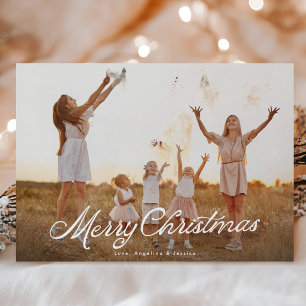 Große weiße Schrift überlagert Frohe Weihnachten
