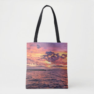 Grosser bunter Sonnenuntergang über dem Wasserstra Tasche