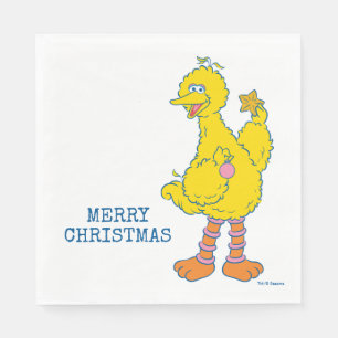 Großer Vogel hält Weihnachtsbaumschmuck Serviette