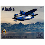 Grumman G-21 Goose Fotoskulptur Magnet<br><div class="desc">Eine postage Briefmarke eines fiktiven unabhängigen Alaska, das ein Grumman G-21 Gänse Amphibienflugzeug darstellt, das bei den Alaska Staat Troopers über Wasser mit Bergen im Hintergrund eingesetzt wird. Text-Lesung, Alaska", "POSTAGE 20 NUGGETS" und "Alaska Staat Troopers Grumman G-21 Gans" erscheinen ebenfalls. Die Grumman Gans wurde 1936 auf Antrag der wohlhabenden...</div>