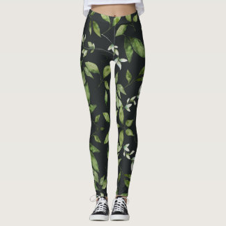grüne Blätter auf schwarzem Hintergrund Leggings