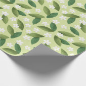 Grüne Blätter und weiße Blume über den grünen Hint Geschenkpapier (Ecke)