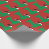 Grüne Dackel mit einem Weihnachtshut Geschenkpapier (Ecke)